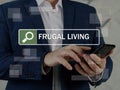 FRUGAL LIVING text in search line. Loan officer looking for something at smartphone. Frugal livingÃÂ is the act of being very